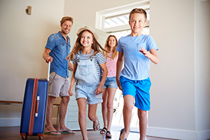 Family with young kids arriving at Seaside Park rental